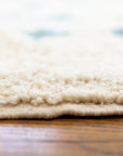 Close up showing pile height of Ouive Solstice Moroccan rug in Jardin Green