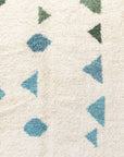 Overhead shot of Ouive Solstice Moroccan rug in Jardin Green