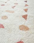 Close up of beige and mauve handspun yarn used in Solstice Moroccan rug