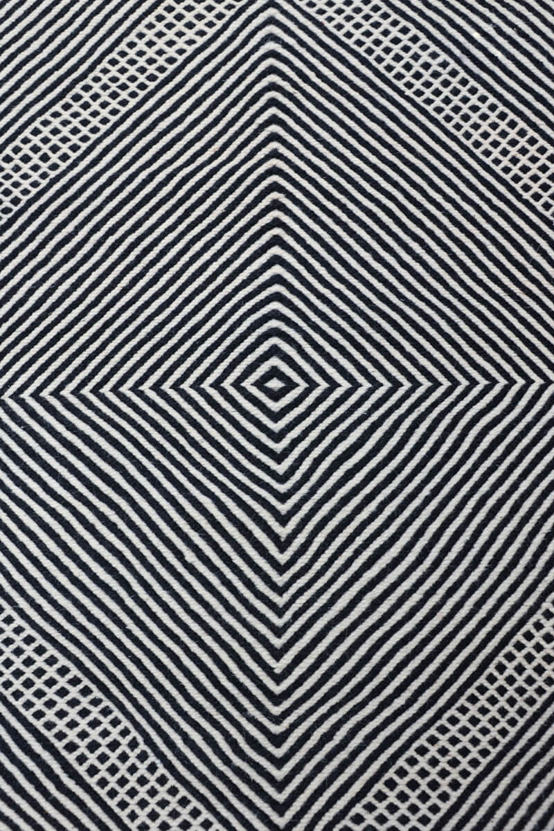 close up of diamond pattern from above Black + White Moroccan Wool Rug
