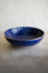 Blue Chabi Chic Empreinte ceramic Moroccan bowl with intricate patterns on a textured surface and white background
