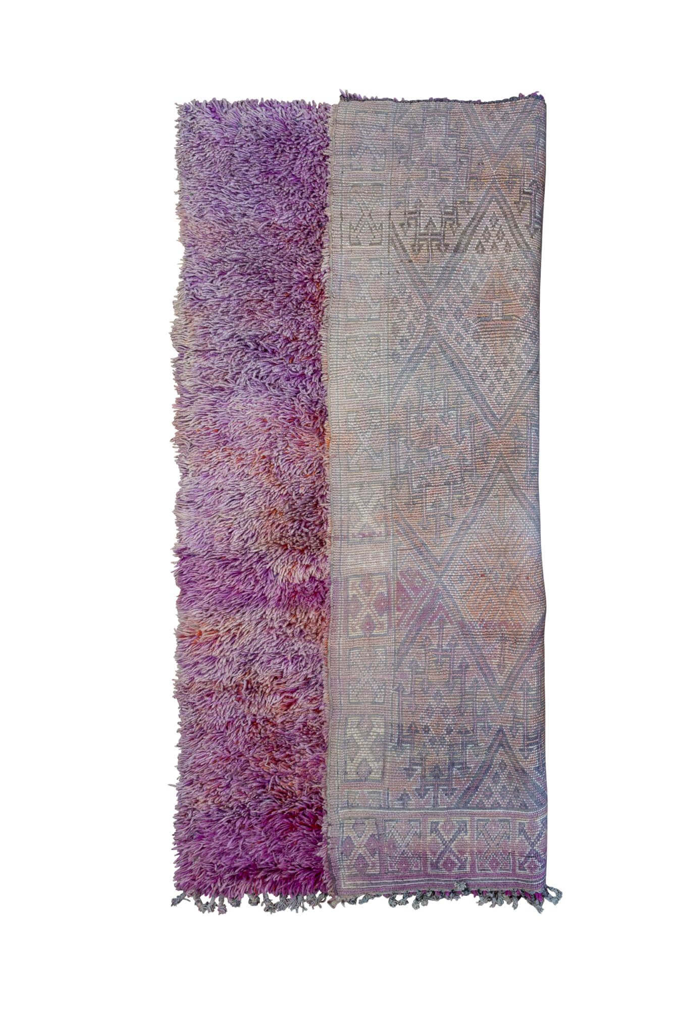 Shag pile purple and orange beni mguild moroccan rug with rug half flipped to show backside