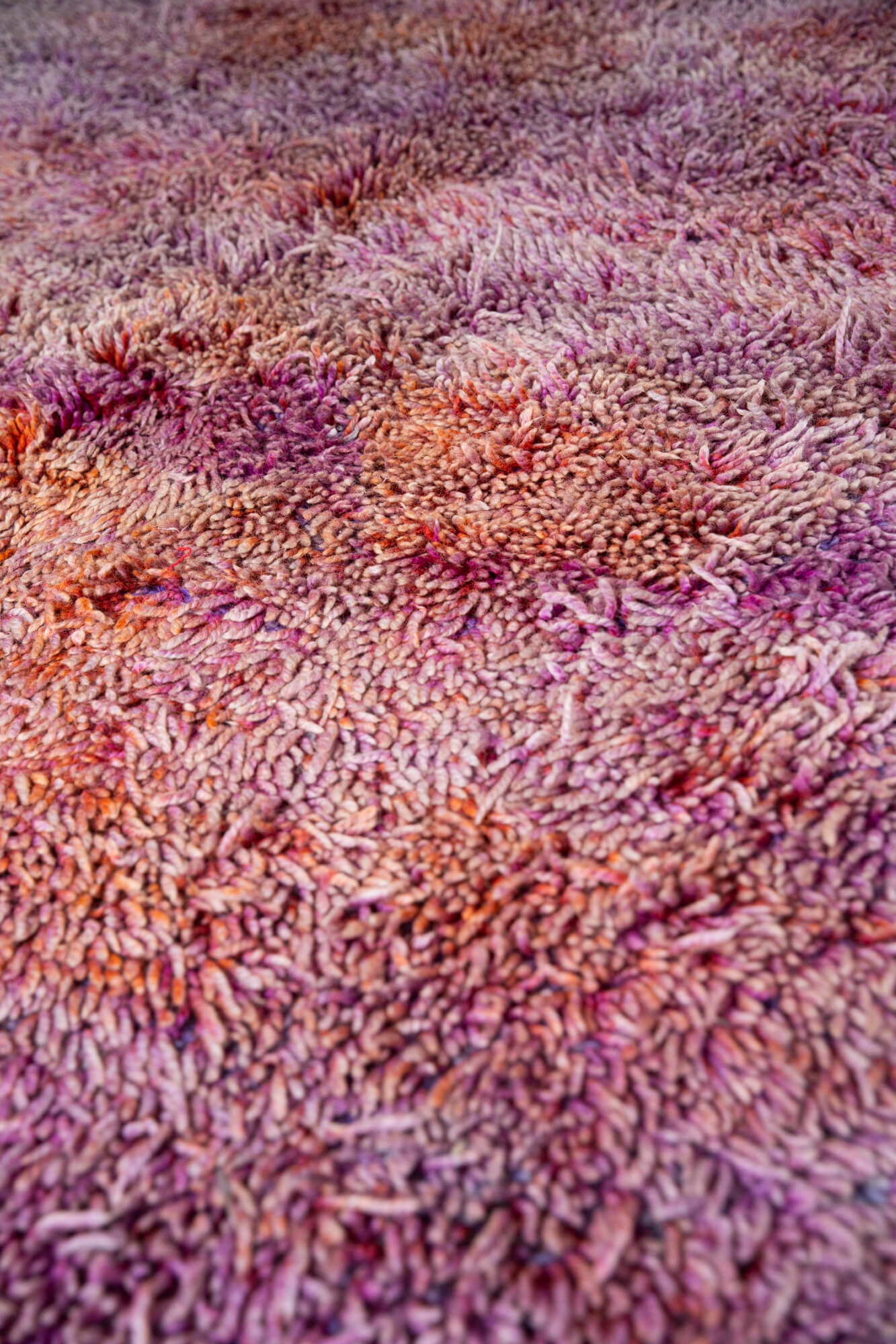 close up of purple and orange high pile shag moroccan rug