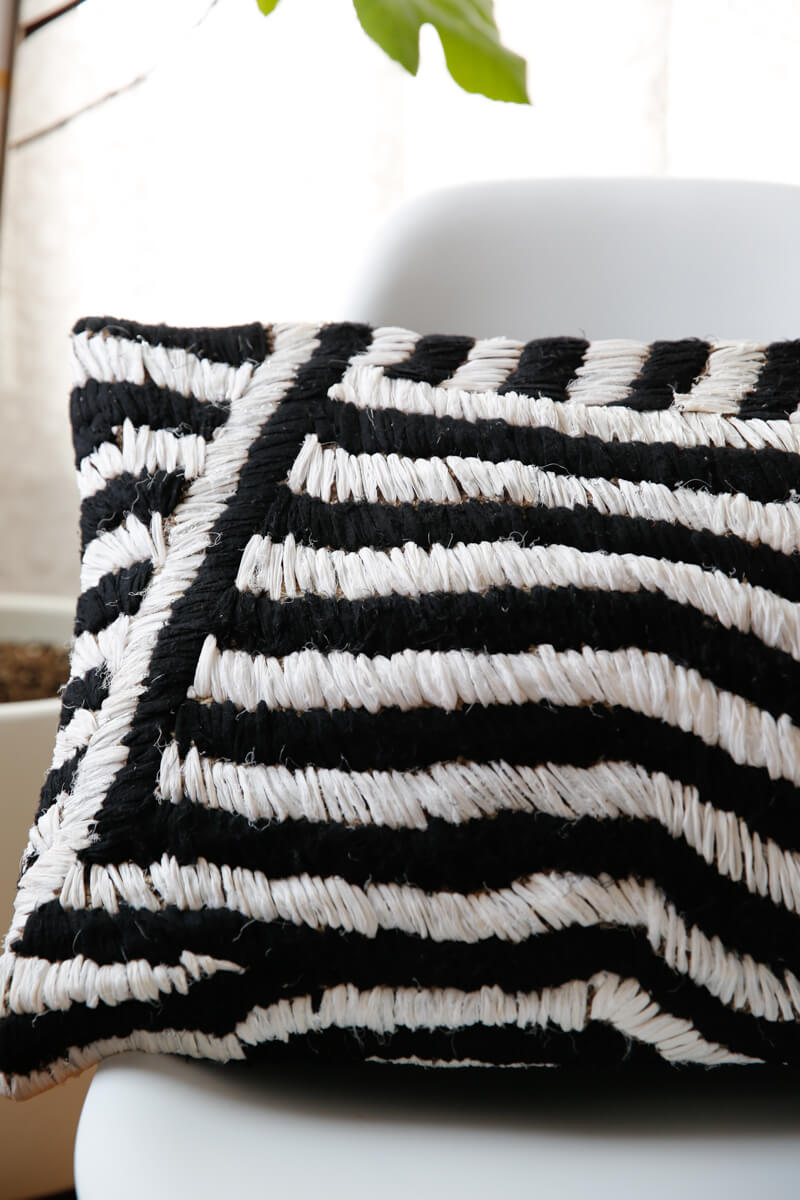 Unique black and white throw pillow hand made from recycled materials