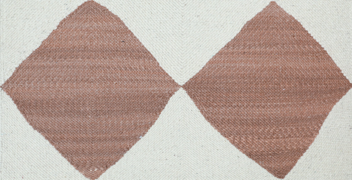 Close up of Redwood and white Diamond Zanafi Moroccan rug