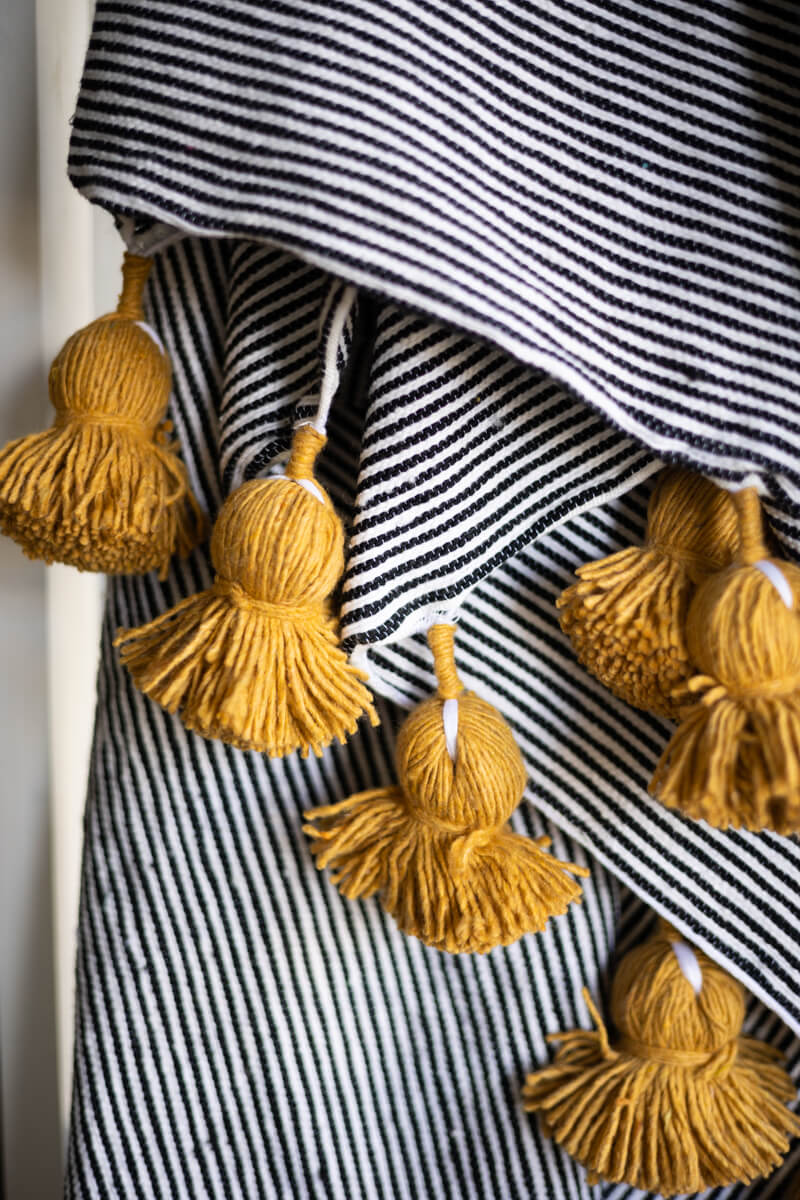 Moroccan Pom Pom Throw Blanket - Black and White Stripe with Mustard Yellow Pom-poms