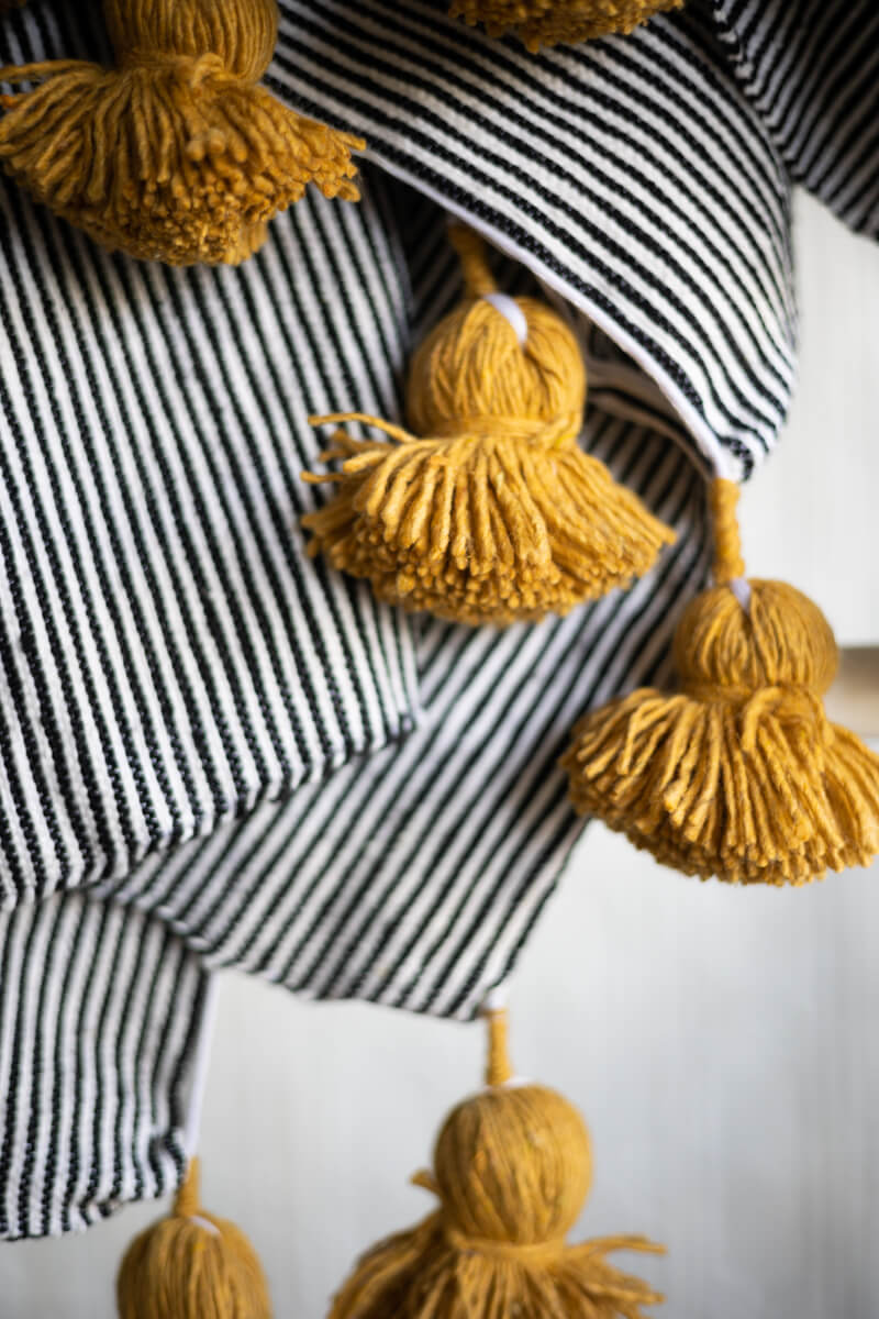 Moroccan Pom Pom Pillow Black and White Stripe with Mustard