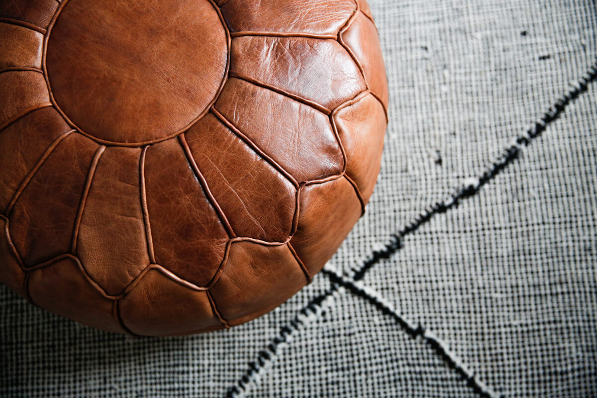 Toffee colored round natural leather pouf - 22&quot;x14&quot;inches