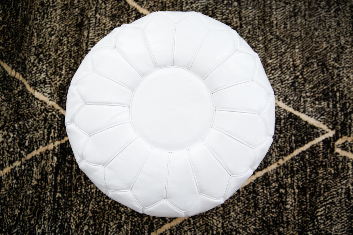 White moroccan leather floor pouf with plain piping