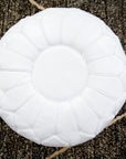 White moroccan leather floor pouf with plain piping