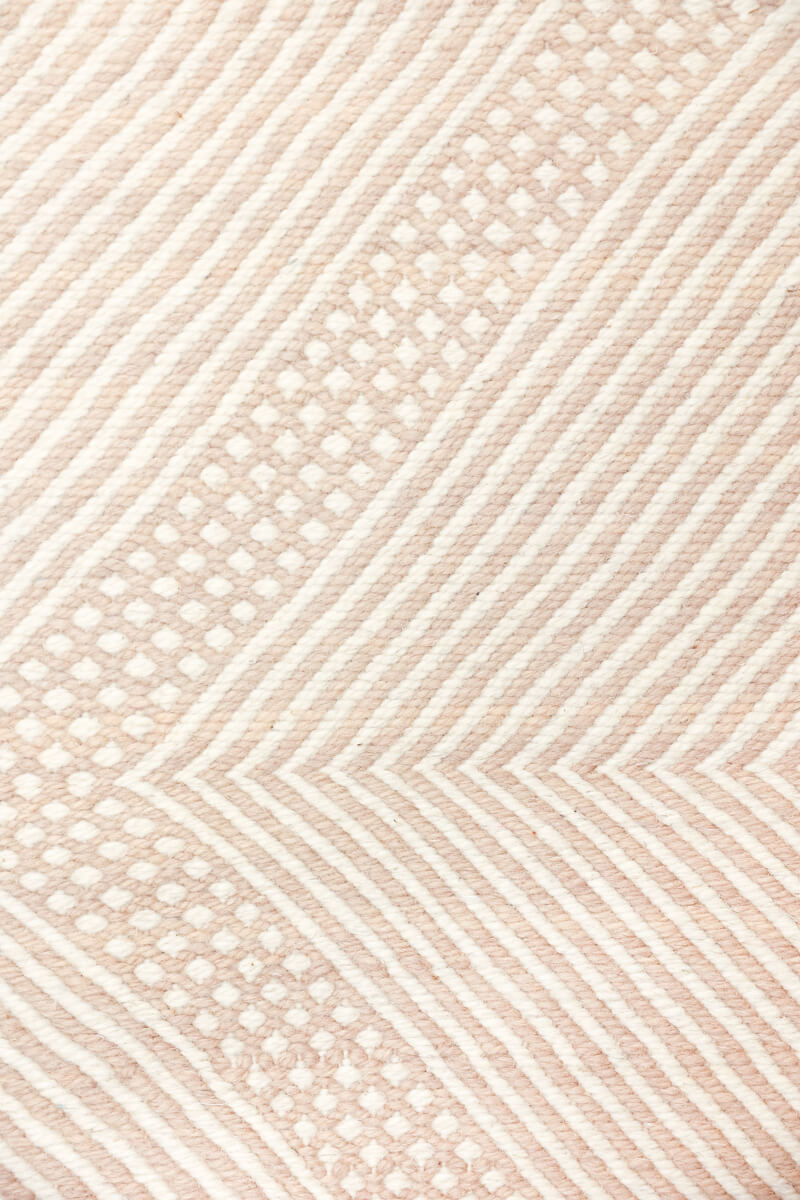 Close up of weaving on Champagne Blush + White Made-to-order Zanafi Moroccan Wool Rug